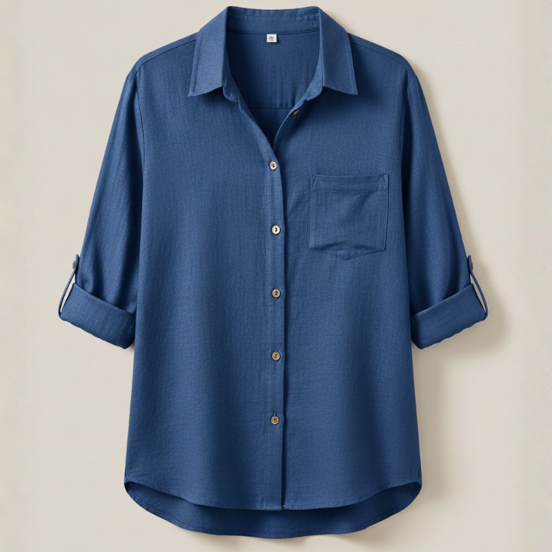 Blue shirt with rolled-up sleeves on a beige background