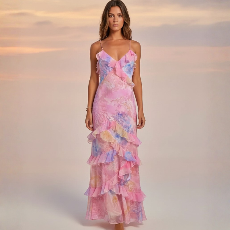 Woman wearing a pink floral dress against a soft gradient background