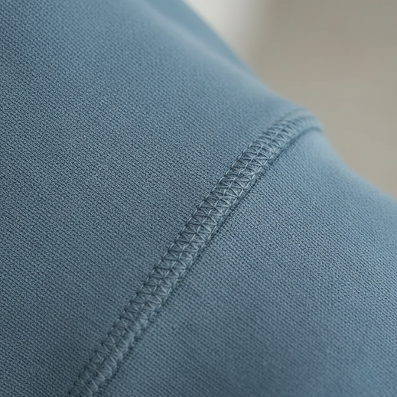 Close-up of a blue fabric with stitching detail