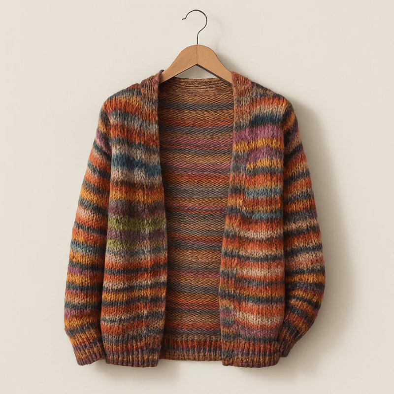 Striped sweater on a hanger against a plain background
