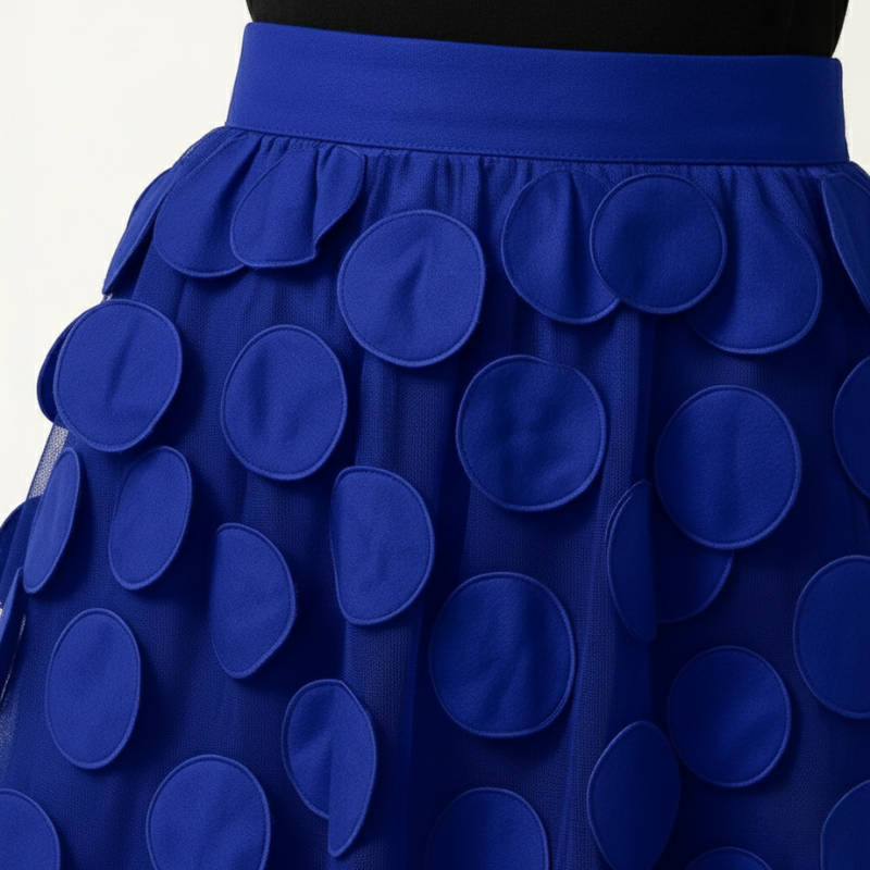 Blue skirt with circular patterns on a white background