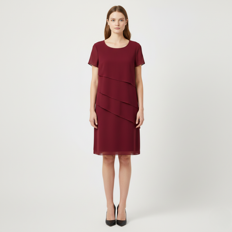 Woman wearing a burgundy dress on a white background