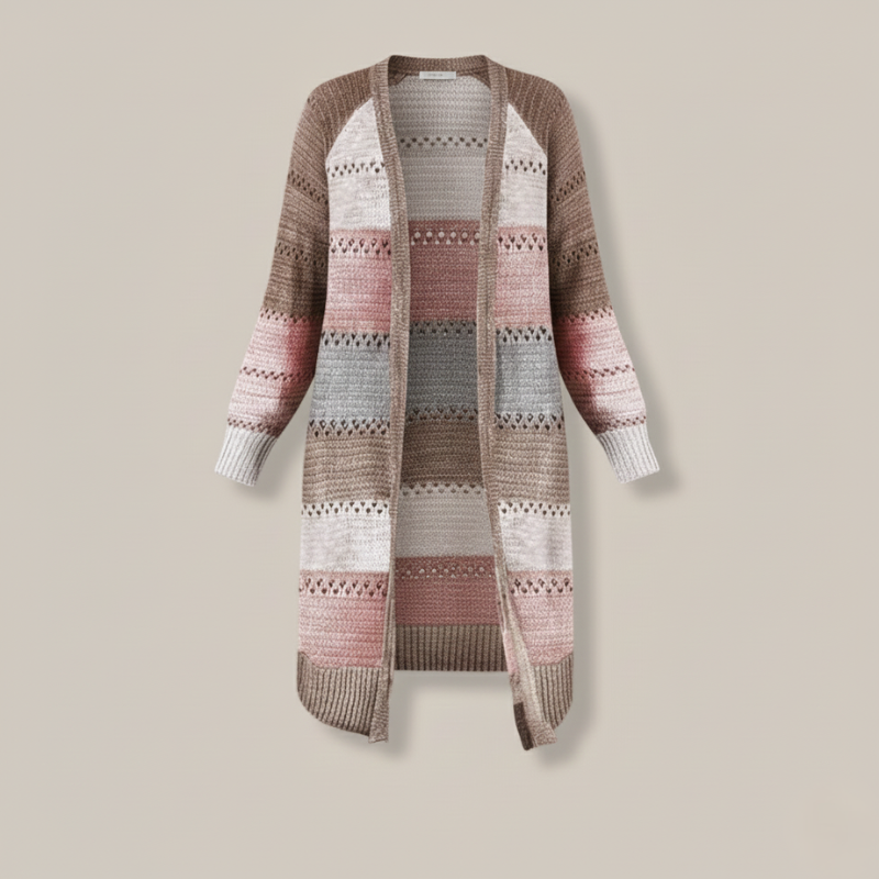 Flatlay of a long patchwork knit cardigan showing mixed color blocks, stitching, and relaxed silhouette.