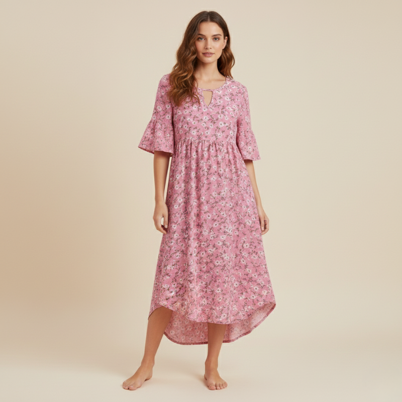 Woman wearing a pink floral dress on a beige background