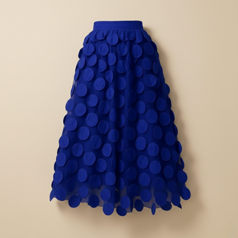 Blue polka dot skirt on a beige background