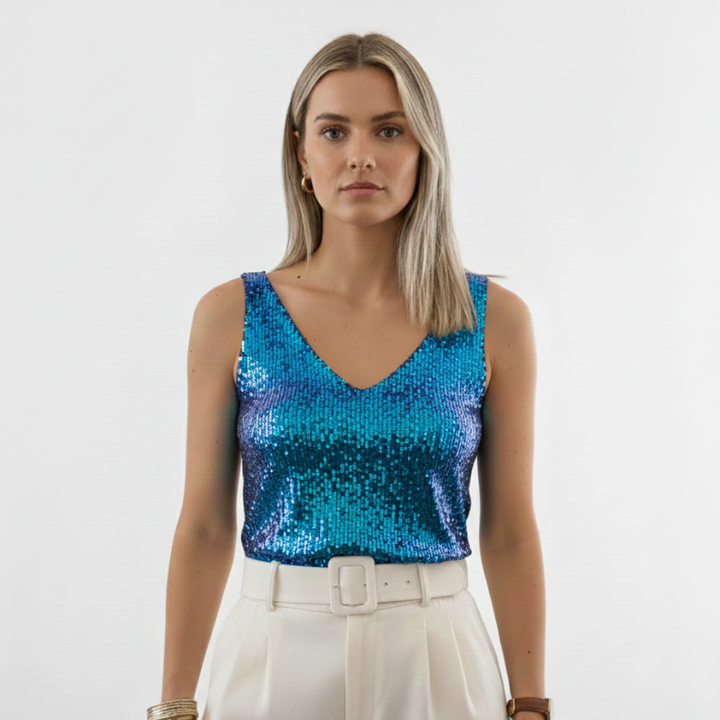 Woman wearing a vibrant blue sequin sleeveless top designed for party and evening looks.