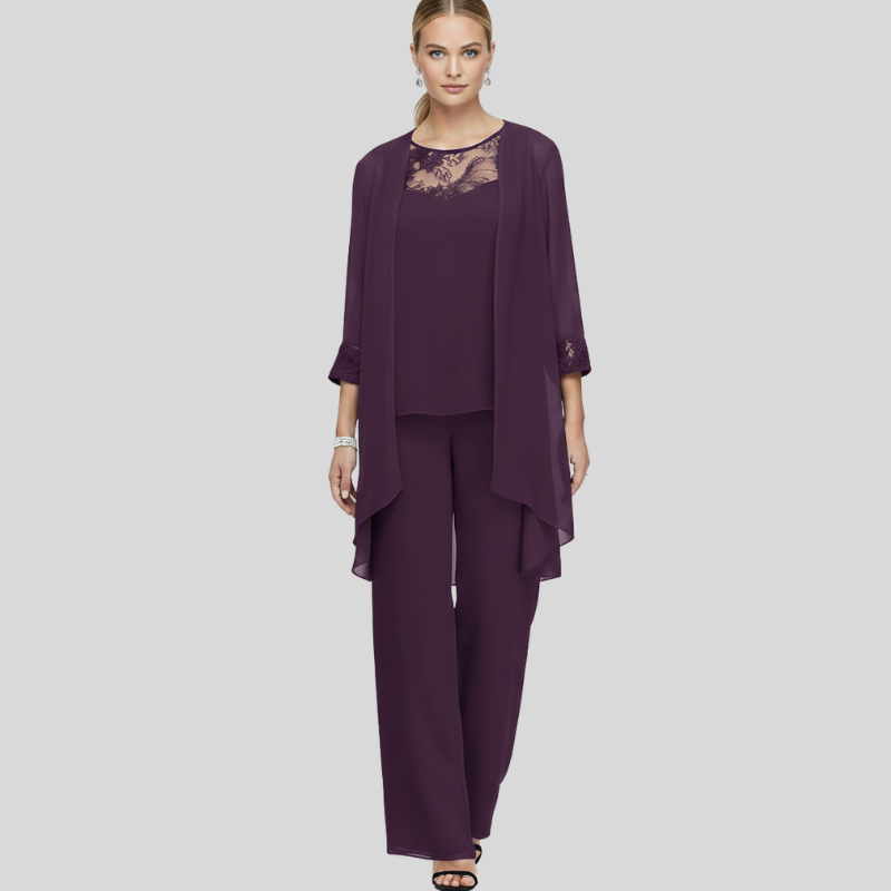 Female model in a deep purple chiffon pant set with lace neckline and elegant draped layers.